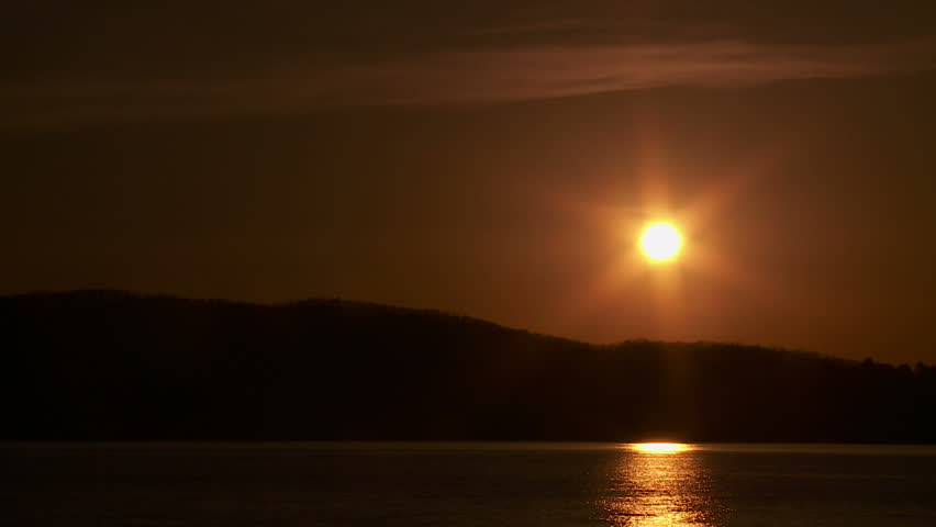 The sun reflects off the Hudson River shortly before sunset.