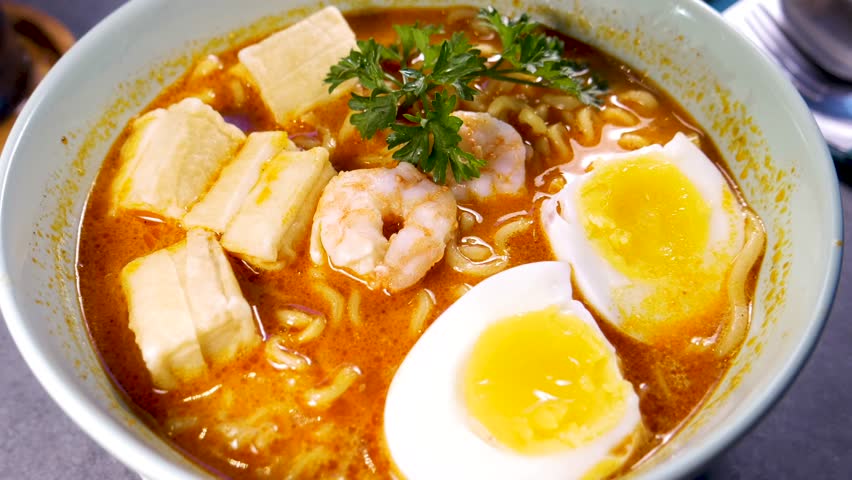 Singapore laksa with savory red sauce and broth