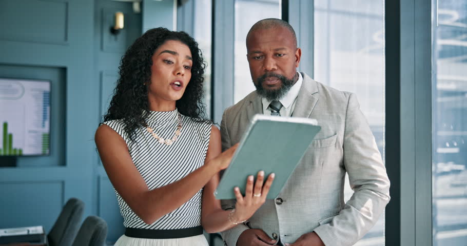 Office, business people and solution with tablet for discussion, finance and investment research. Team, mature investor and financial advisor with tech for risk management, report and problem solving