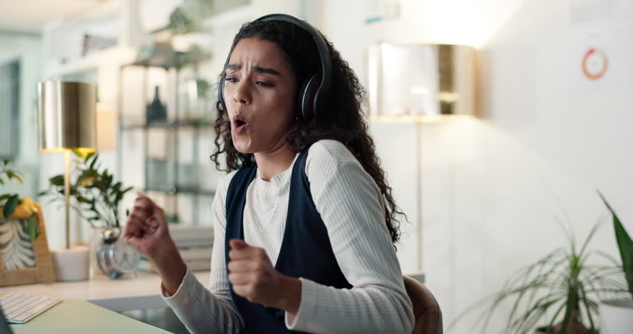 Headphones, business woman and dance to music, radio or celebration for promotion in office. Audio, excited worker and listening to sound for success, win and streaming playlist in creative startup