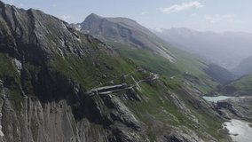 Grossglockner High Alpine Road cuts through rugged peaks, green slopes, Austria - Powered by Shutterstock - Get 15% off with code: PIKWIZARD15