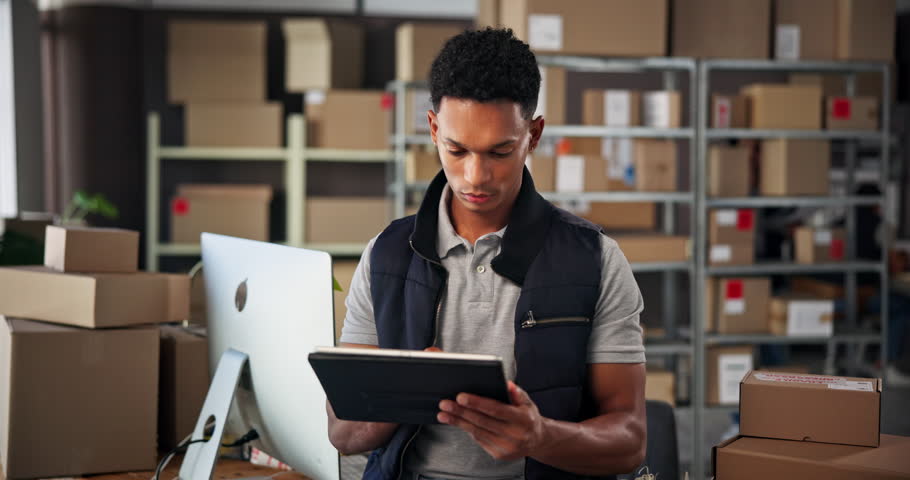 Office, man and research with tablet for logistics, supplier distribution and ecommerce for startup. Workshop, male person and seller with digital for supply chain, business service and track order