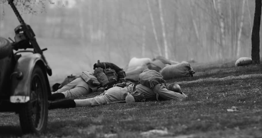Historical Re-enactment Black And White Video. Soviet Russian Infantry Soldier In World War Ii. Re-enactor Dressed As Soviet Russian Soldier Lies Slain In Reconstruction Of Battles World War I Near