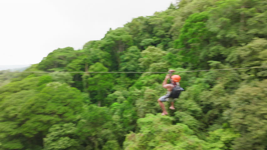 Experience the stunning beauty and rich biodiversity of Costa Rica on an exhilarating zipline adventure, soaring high above the lush jungles and enjoying the enchanting and picturesque scenery below