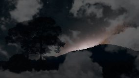 Dolly view of Galaxy moving back silhouette mountain and tree with dark cloud on the night sky time lapse Video - Powered by Shutterstock - Get 15% off with code: PIKWIZARD15