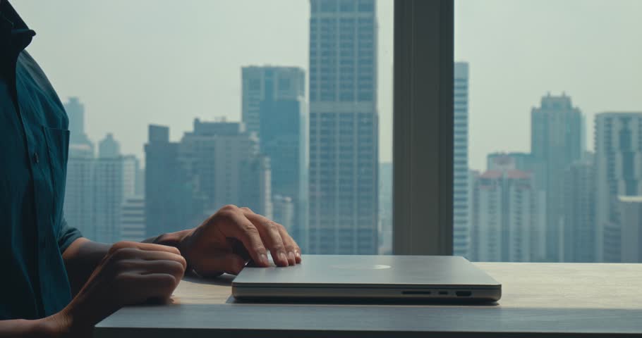 Employee begins remote tasks with stunning view, employee demonstrating efficiency and dedication, employee embracing flexible schedule, highly relevant for corporate culture footage.