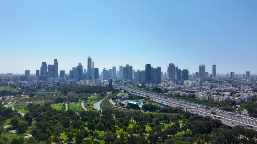 Tel Aviv , Israel - City skyline And Ayalon Highway heavy traffic .