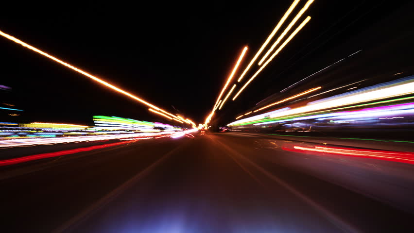 Driving Through a Futuristic Illuminated Street at High Speed. Experiencing a Fast-Paced Journey Through a Modern City with Bright Green and Blue Lights. Capturing the Sensation of Speed and the - Powered by Shutterstock - Get 15% off with code: PIKWIZARD15