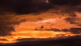 Majestic Sunset Clouds Transforming in a Breathtaking Display of Colors. Vibrant Sunset Painting Sky with Dramatic Orange, Purple, and Grey Hues, Revealing Mesmerizing Cloud Formations Transforming - Powered by Shutterstock - Get 15% off with code: PIKWIZARD15