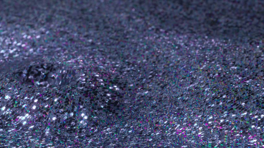 Silver glittering fabric with iridescent sequins is slowly waving, creating beautiful reflections and a mesmerizing play of light and shadows. 3D Illustration
