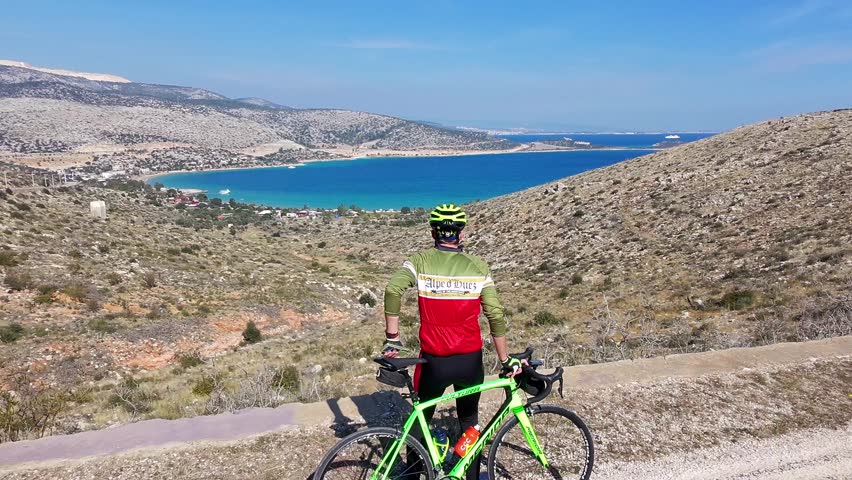 Bogsak Halk Plaji, Taşucu, Silifke, Mersin, Turkey - 03.08.2025 -Sports Challenge: Road Cyclist Conquering Mountain Peaks