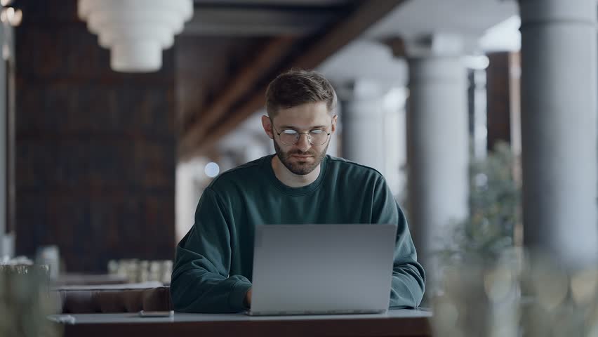 Freelance And Online Job, Middle Aged Man Typing On Laptop Keyboard When Sitting In Cafe - Powered by Shutterstock - Get 15% off with code: PIKWIZARD15
