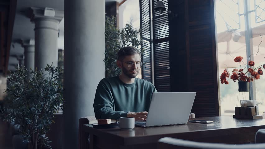 Startup Owner Typing Messages On Laptop Keyboard And Sending Messages, Businessman In Cafe - Powered by Shutterstock - Get 15% off with code: PIKWIZARD15