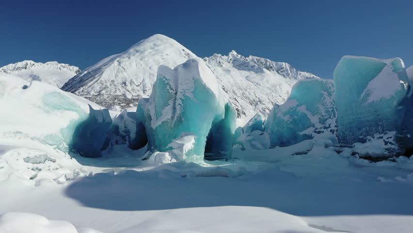 Aerial view of majestic glaciers and snowy mountains in pristine wilderness, Chugach National Park, Valdez, Alaska, United States.