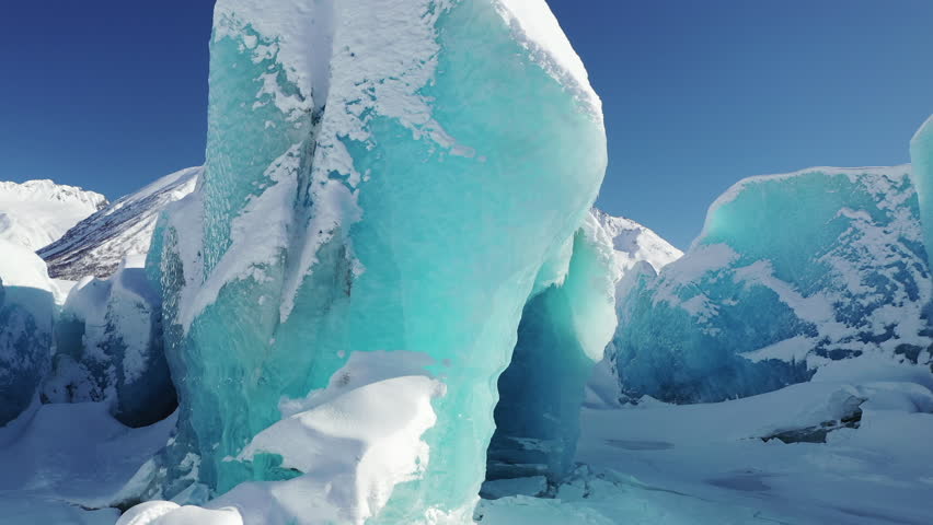 Aerial view of majestic glacier and snowy mountains in Chugach National Park, Valdez, Alaska, United States.