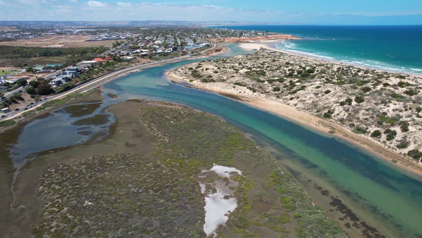 Aerial view of Onkaparinga River Ngangkiparri with sandy beach and coastal vegetation, Port Noarlunga South, South Australia, Australia.
