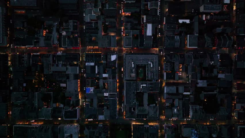 Aerial view of beautiful cityscape with vibrant city lights and traffic at night, French Quarter, Louisiana, United States.