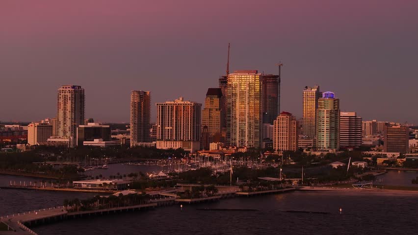 Aerial view of downtown skyline at sunrise with St. Pete Pier and marina, St. Petersburg, Florida, United States.