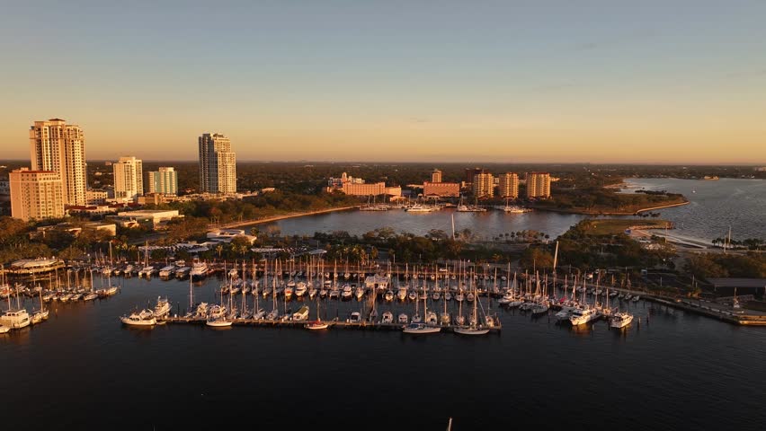 Aerial view of downtown skyline with marina and boats at sunset, St. Petersburg, Florida, United States.