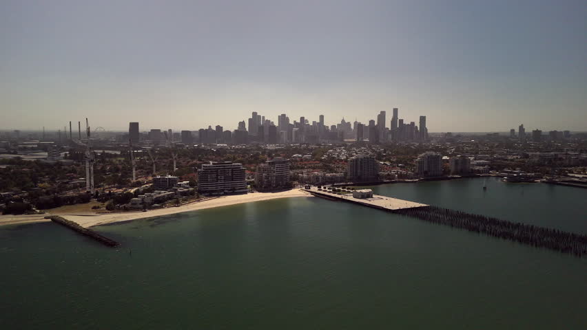 Port Melbourne aerial footage of the beach, docks and harbour area.
