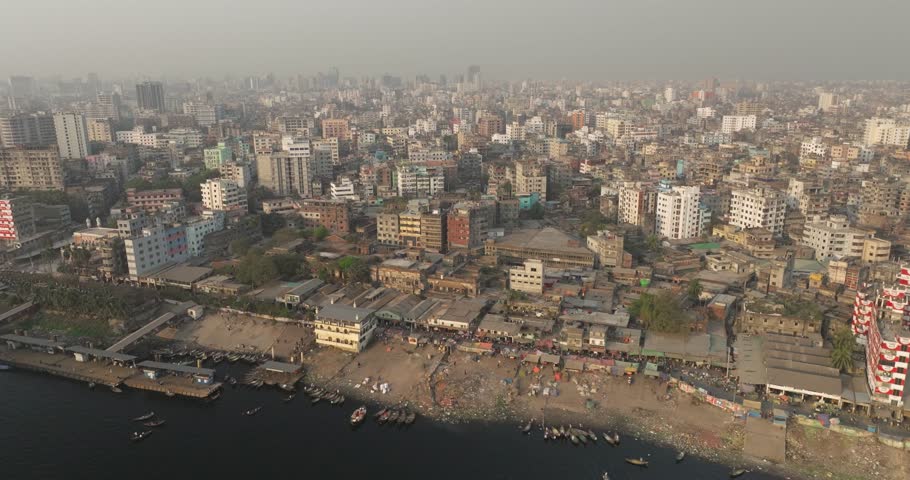 Aerial view of bustling Sadar Ghat along the Buriganga river with numerous boats and modern buildings, Dhaka, Dhaka Province, Bangladesh.