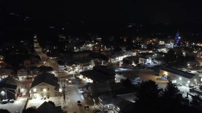 St-Sauveur, Quebec, at night during winter, with a cityscape of illuminated streets and snow-covered rooftops. - Powered by Shutterstock - Get 15% off with code: PIKWIZARD15