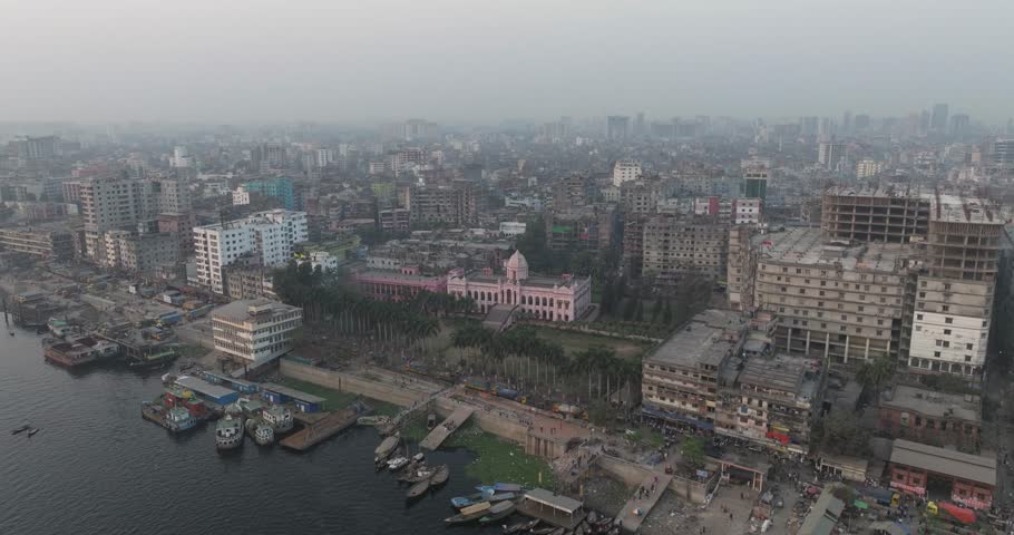 Aerial view of bustling Sadar Ghat along the Buriganga River with dense cityscape and busy boats, Dhaka, Dhaka Province, Bangladesh.