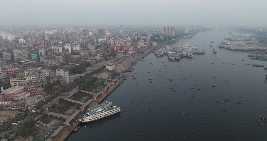 Aerial view of Sadar Ghat on Buriganga river with bustling boats and modern buildings, Dhaka, Dhaka Province, Bangladesh.
