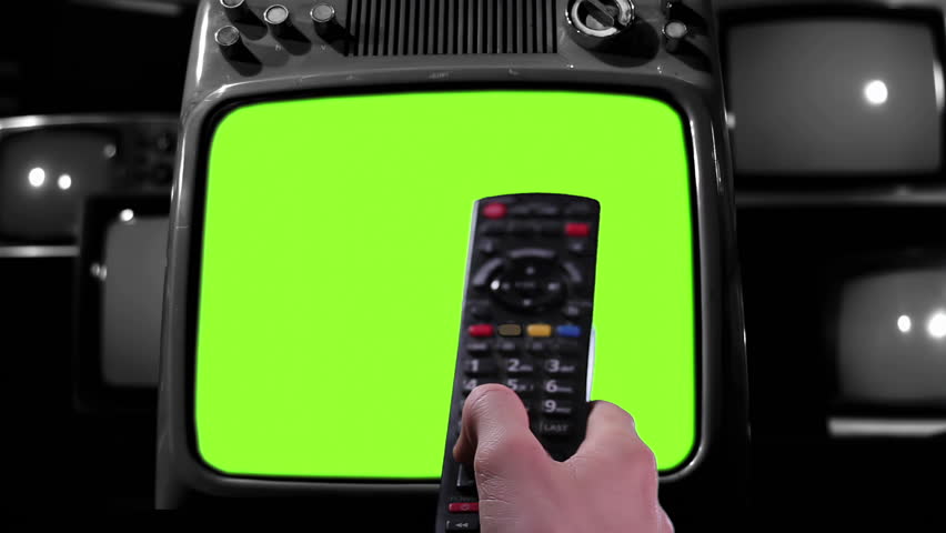 Remote Control Turning On an Old TV With Green Screen, Surrounded by Vintage TVs, Black and White Tone - 4K