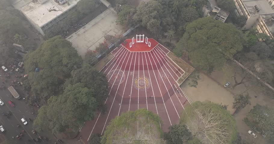 Aerial view of central shaheed minar surrounded by trees and park, Shahbag, Dhaka, Bangladesh.
