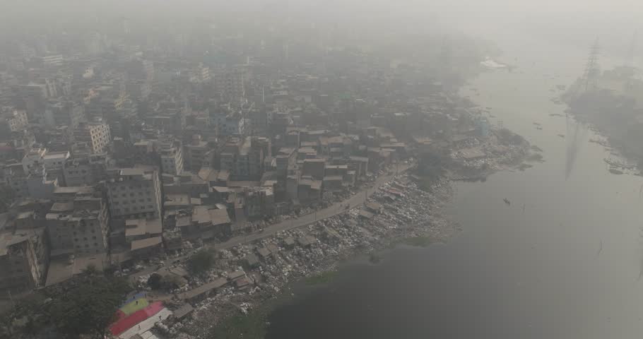 Aerial view of bustling cityscape with modern buildings and the Buriganga river, Dhaka, Dhaka Province, Bangladesh.