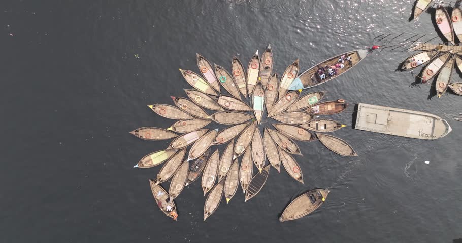 Aerial view of traditional boats docked along the clear Buriganga River, Dhaka, Dhaka Province, Bangladesh.