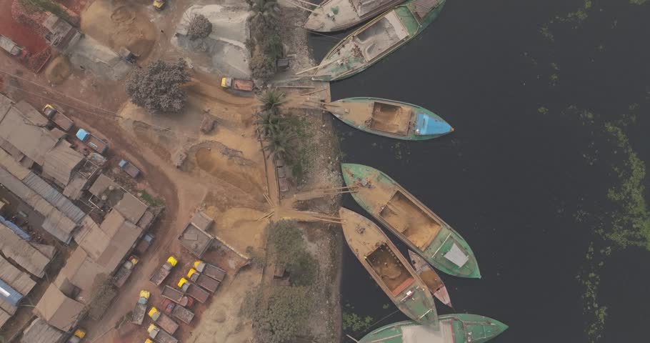 Aerial view of Buriganga river with busy boats and cement industries, Dhaka, Dhaka Province, Bangladesh.