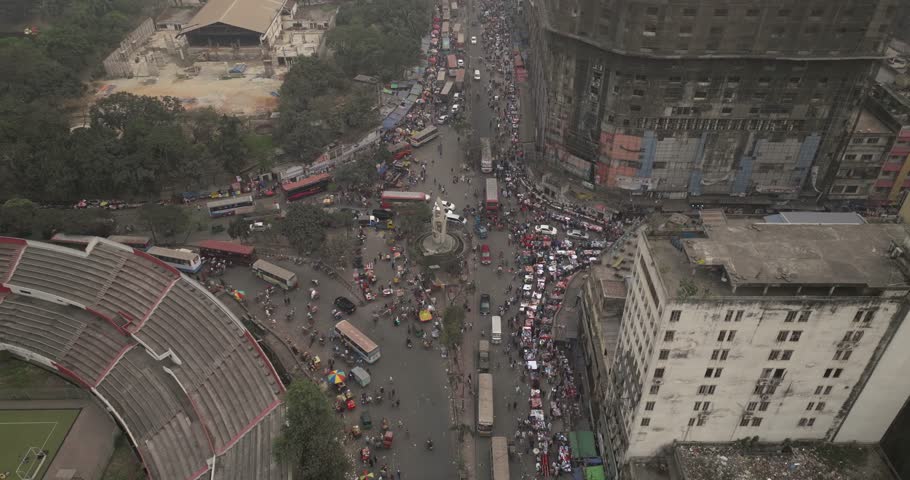 Aerial view of bustling downtown roundabout with busy traffic and high-rise buildings, Dhaka, Dhaka Province, Bangladesh.