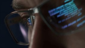Extreme close-up of a programmers eye with computer code reflecting on glasses, symbolizing cybersecurity, coding, and software development.  - Powered by Shutterstock - Get 15% off with code: PIKWIZARD15