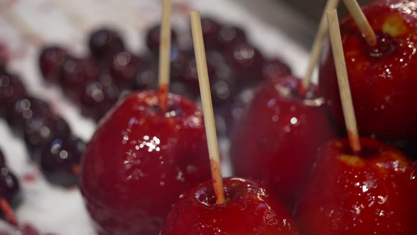 Close up of toffee apples on candy stall at Christmas market in Breitscheidplatz, Berlin, Germany