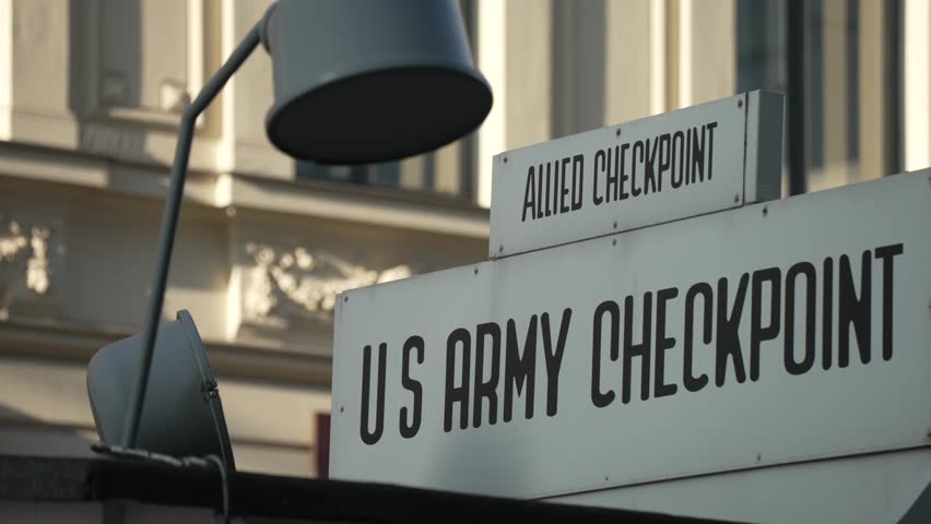 US Army Checkpoint sign at Checkpoint Charlie on a sunny day, Friedrichstrasse, Berlin, Germany