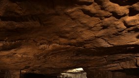 Aged wooden barrels with a wine in a former stone quarry, row of wine barrels at a vintage winery, Wine preparation and fermenting process - Powered by Shutterstock - Get 15% off with code: PIKWIZARD15