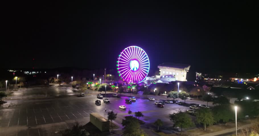 Drone view of Myrtle Beach Ferris wheel and entertainment park at night