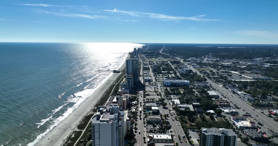 Aerial view of hotels and condos on Myrtle Beach coastline on a sunny day