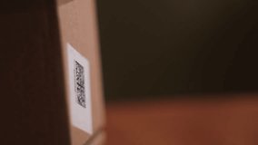 laser scanner reads QR code on parcel close-up, laser beam scans barcode - Powered by Shutterstock - Get 15% off with code: PIKWIZARD15