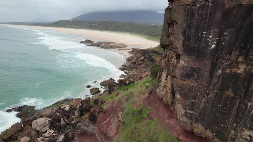 Rock Formation At Charles Hamey Lookout With View Of Dunbogan Beach In Barrington Coast, NSW, Australia. drone shot
