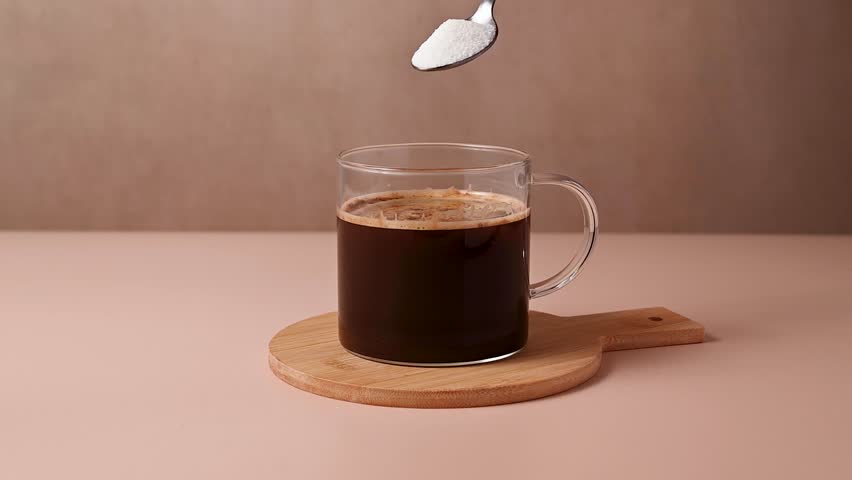 Pour the sugar into the coffee cup. Sugar addiction 