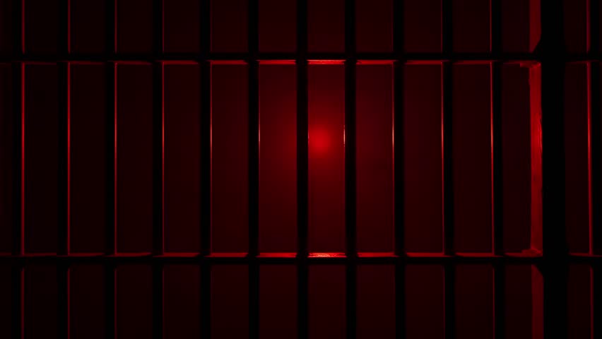 Prison Cell Bars Casting Shadows: Symbolizing Confinement and Loss of Freedom. metal prison cell bars casting shadows on the floor, representing themes of incarceration, confinement