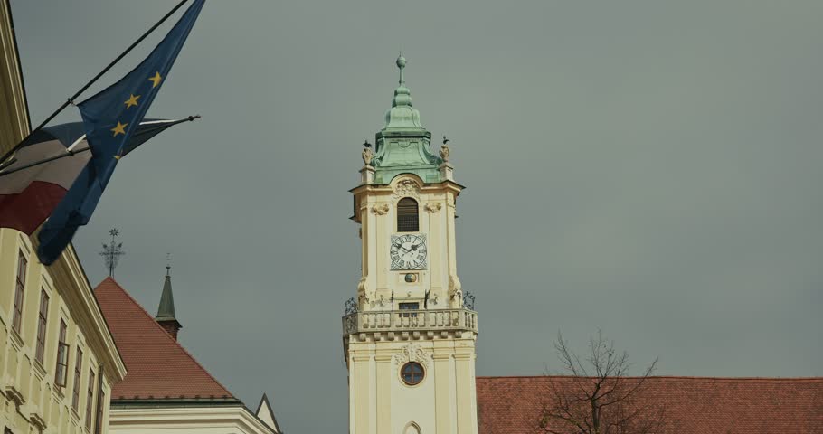 Bratislava Old Town Hall tower framed by the European Union flag in the wind