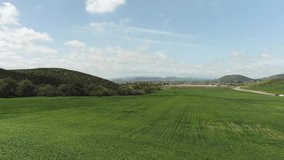 Real UAV Quadcopter Drone Flying Slow Motion Outdoors Over Lush Farmland. - Powered by Shutterstock - Get 15% off with code: PIKWIZARD15
