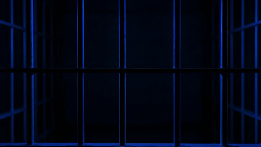 Prison Cell Bars Casting Shadows: Symbolizing Confinement and Loss of Freedom. metal prison cell bars casting shadows on the floor, representing themes of incarceration, confinement