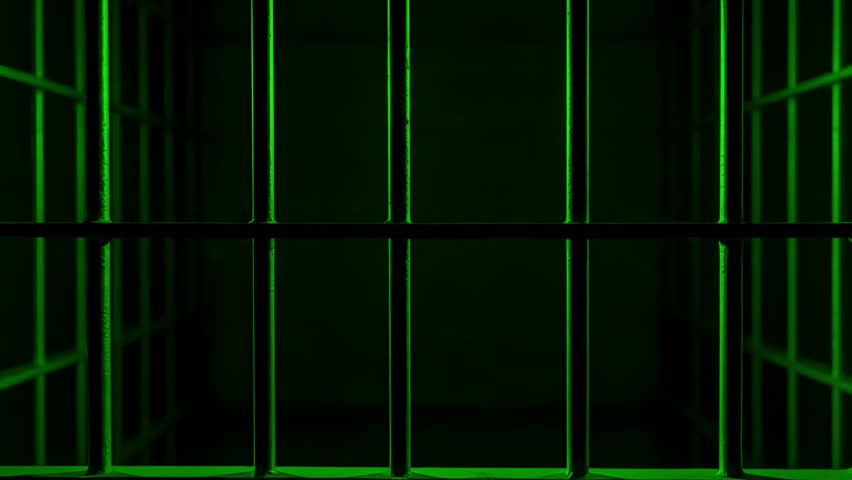 Prison Cell Bars Casting Shadows: Symbolizing Confinement and Loss of Freedom. metal prison cell bars casting shadows on the floor, representing themes of incarceration, confinement