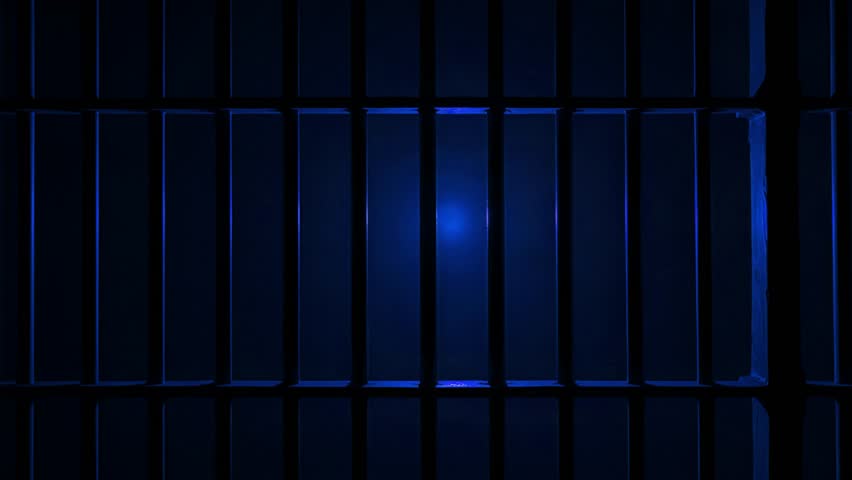 Prison Cell Bars Casting Shadows: Symbolizing Confinement and Loss of Freedom. metal prison cell bars casting shadows on the floor, representing themes of incarceration, confinement