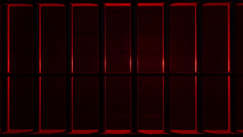 Prison Cell Bars Casting Shadows: Symbolizing Confinement and Loss of Freedom. metal prison cell bars casting shadows on the floor, representing themes of incarceration, confinement